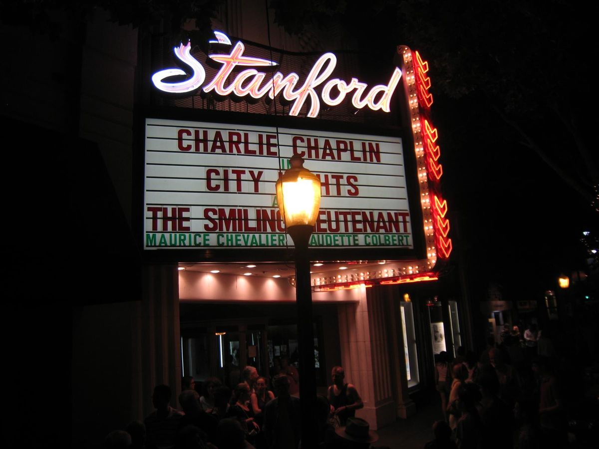 The Stanford Theatre's marquee lit up at night on University Avenue